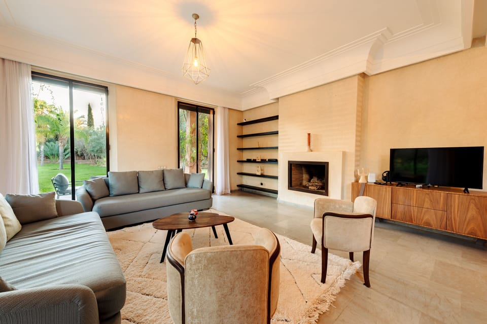 Deluxe Villa | Living area | Flat-screen TV