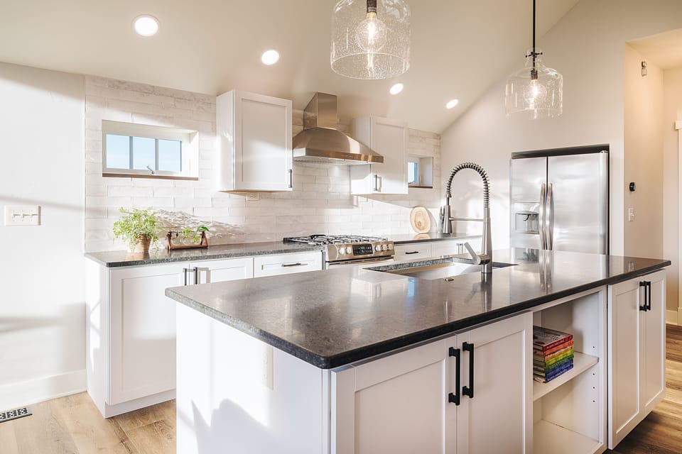 Upstairs, fully-stocked kitchen; well-lit with large island