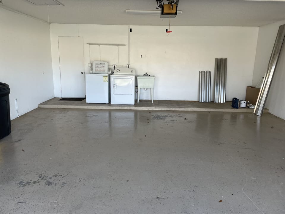 2 car garage with washer and dryer, beach chairs, beach towels and tote