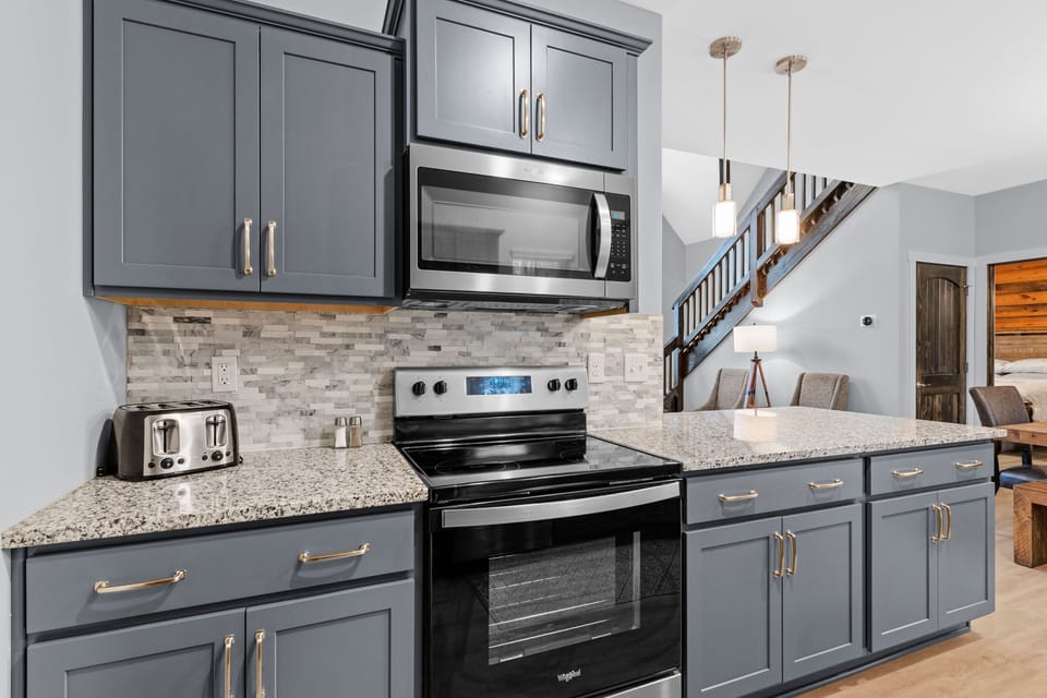 The kitchen has full size appliances. 