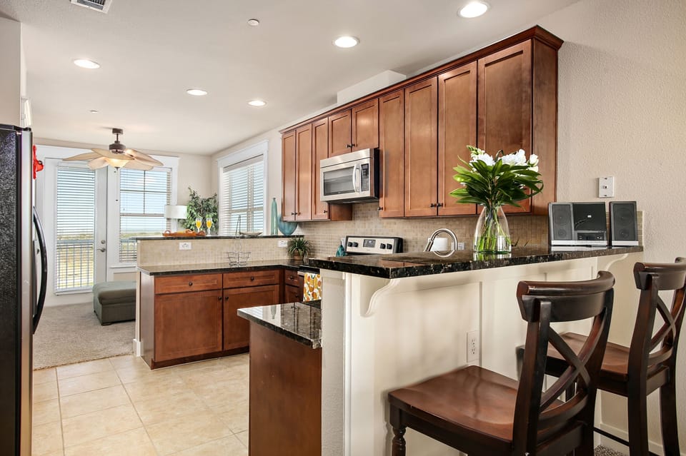 Fully stocked kitchen with all that you'll need to cook family meals. Blender, pots, pans & all cookware included.