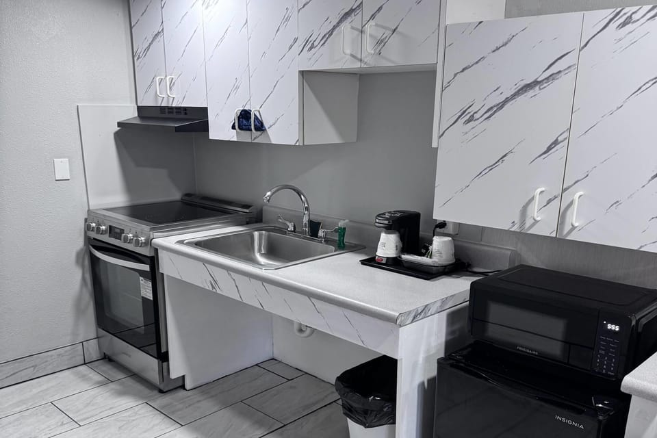 Room, 2 Queen Beds, Accessible, Non Smoking (Mobility/Hearing/Roll-In Shower) | Private kitchenette | Coffee/tea maker, fridge, microwave, dining table