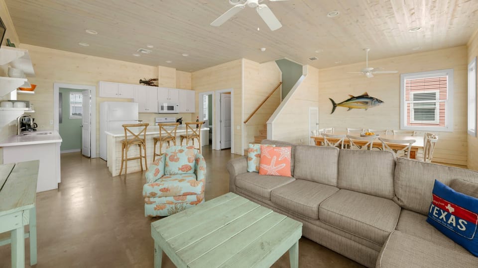 Living Room with Kitchen Bar & Texas-Themed Accents