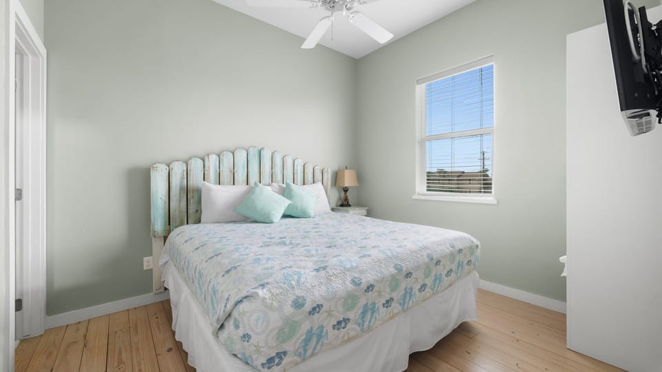Bedroom — Queen Bed with Picket Fence Headboard & Smart TV