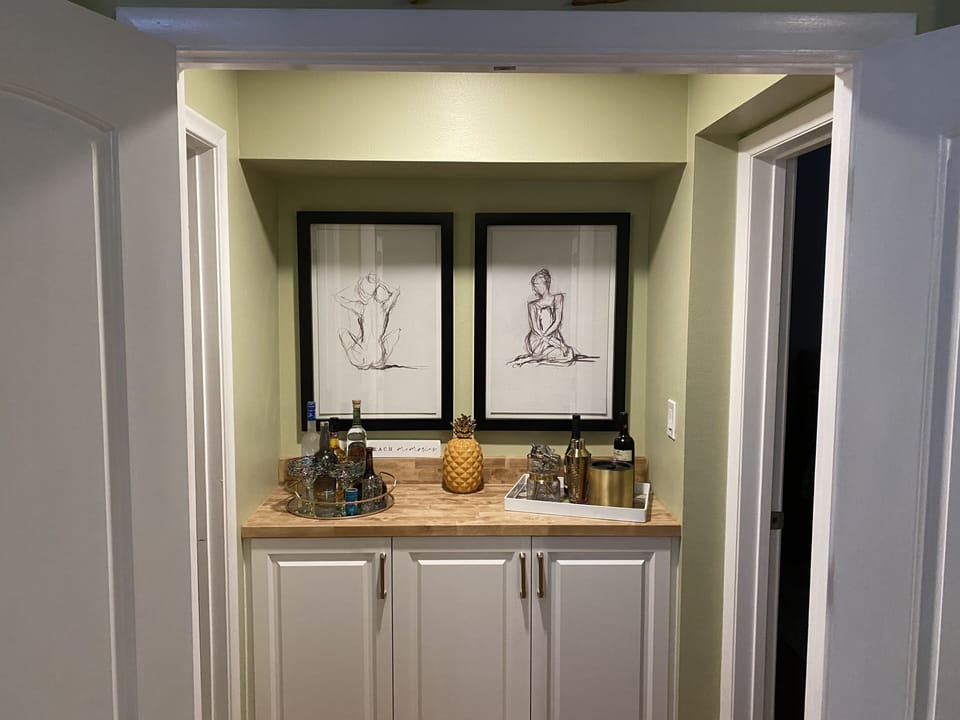 Bar area. The outer double doors close to the master bed/bath creating access. 