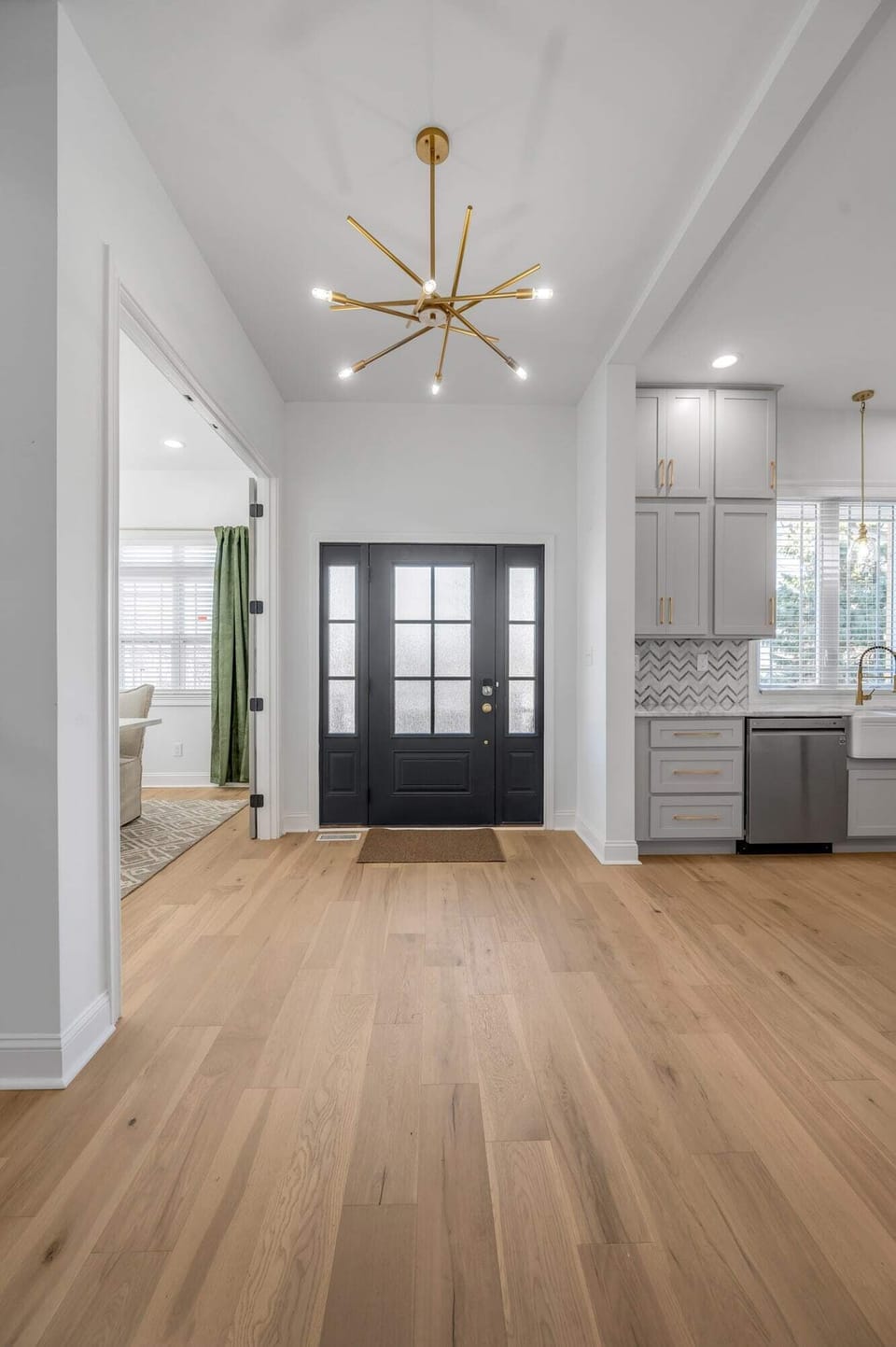 Make a grand entrance in our stunning entryway, featuring white oak floors and a warm, welcoming ambiance.