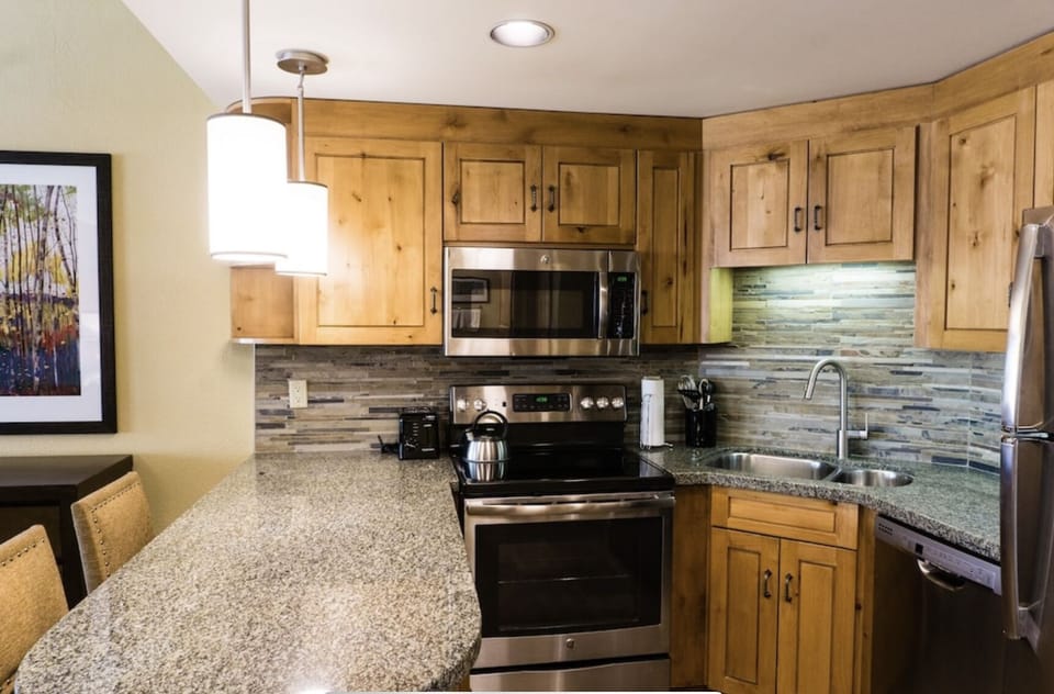 Stove, oven, microwave, dishwasher, refrigerator, kitchen island with seating 