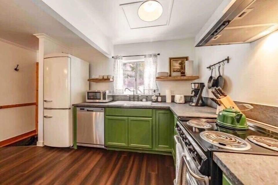 A well-stocked kitchen including coffee, tea and hot cocoa, along with a full set of pots and pans.