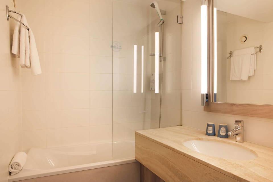 Combined shower/tub, eco-friendly toiletries, hair dryer, towels