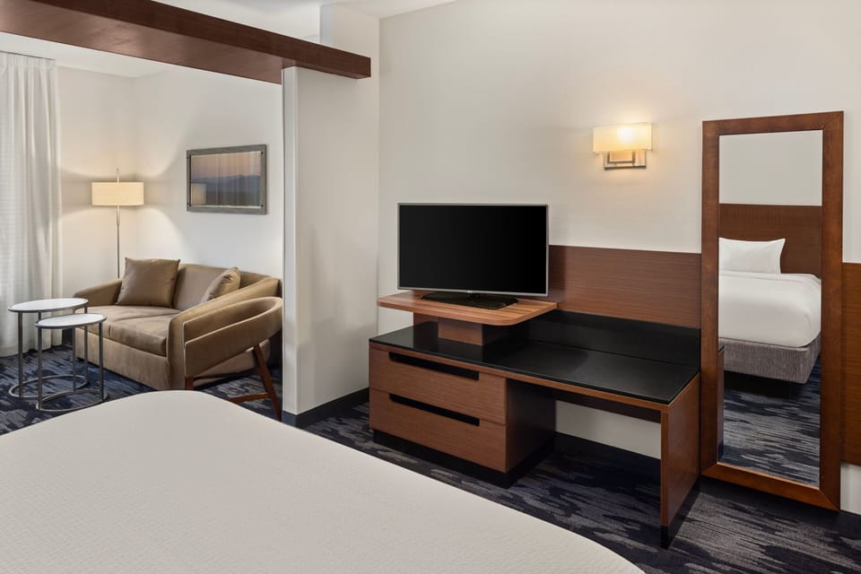 Down comforters, pillowtop beds, desk, blackout drapes