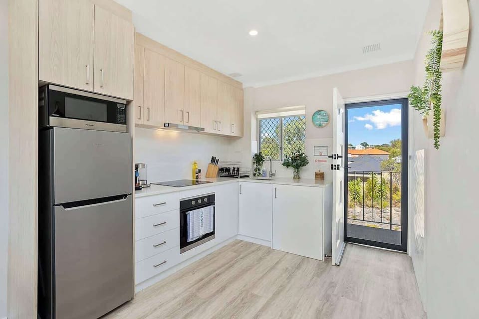 Discover the joy of home-cooked meals in our well-appointed kitchen. From the full-sized fridge to the reliable oven and microwave, we've ensured you have all the essentials for a seamless stay!