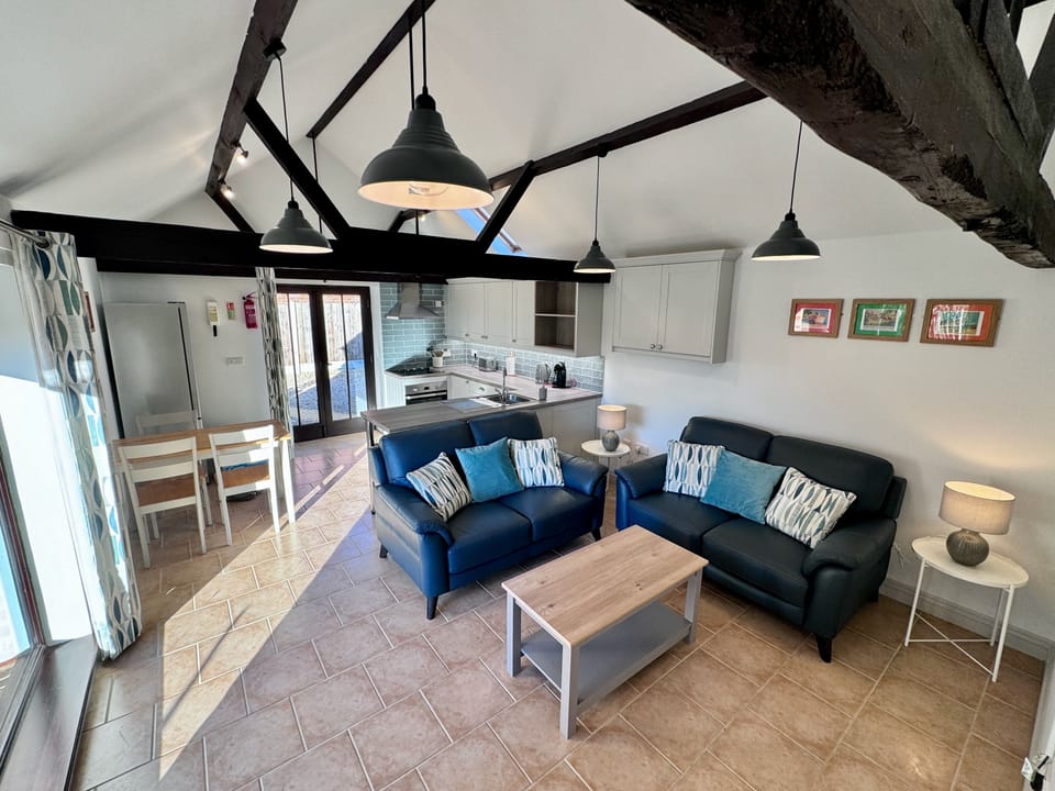 Open plan living with lounge, dining and kitchen areas