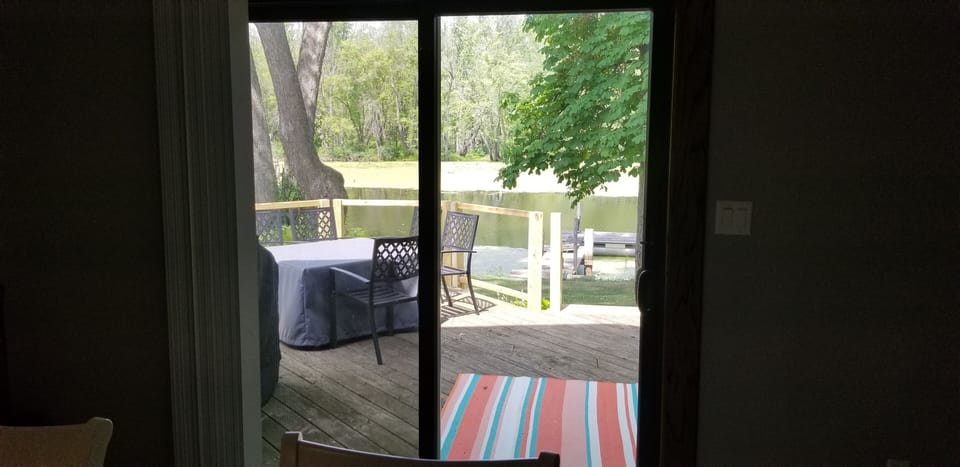 Patio door out to the backyard and Templeton Bayou