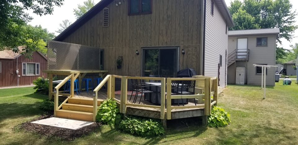 Backyard deck with lots of outdoor seating!
