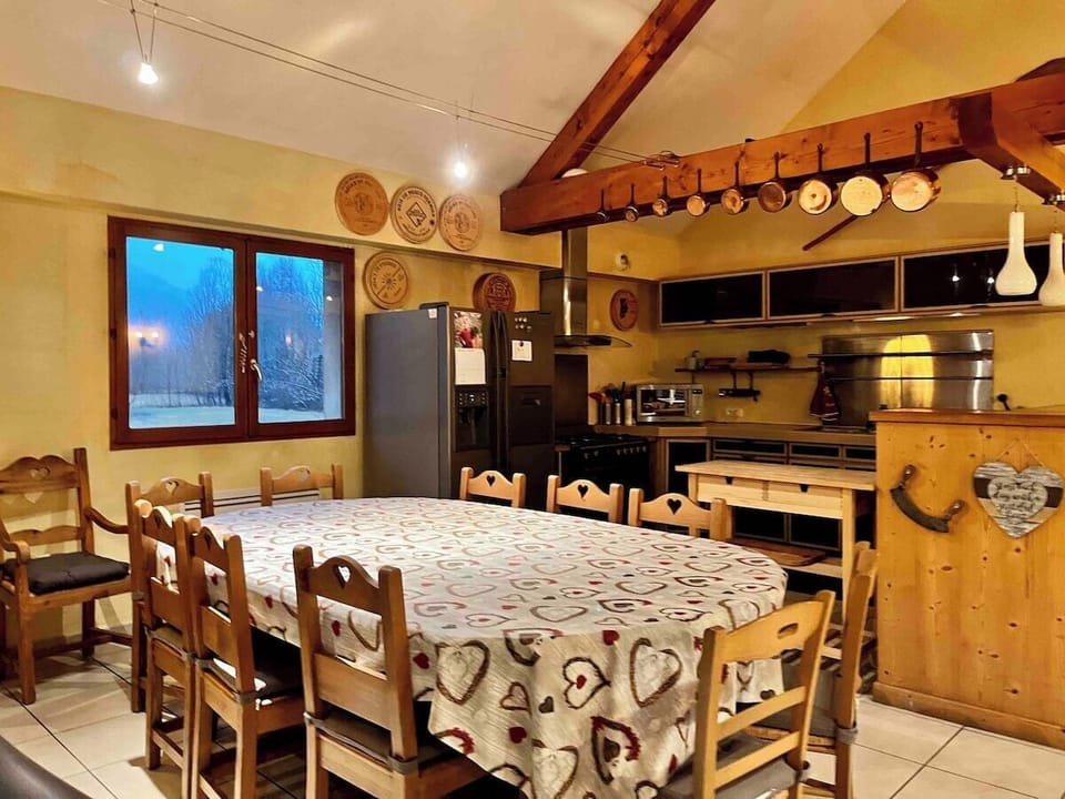 There are two large dining tables in the open plan living area perfect for home dining