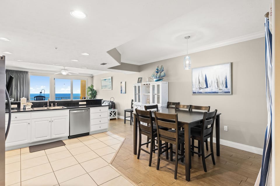 Picture yourself preparing meals in this bright kitchen while enjoying stunning ocean views through the windows—your coastal retreat awaits with beachside dining and spacious living.