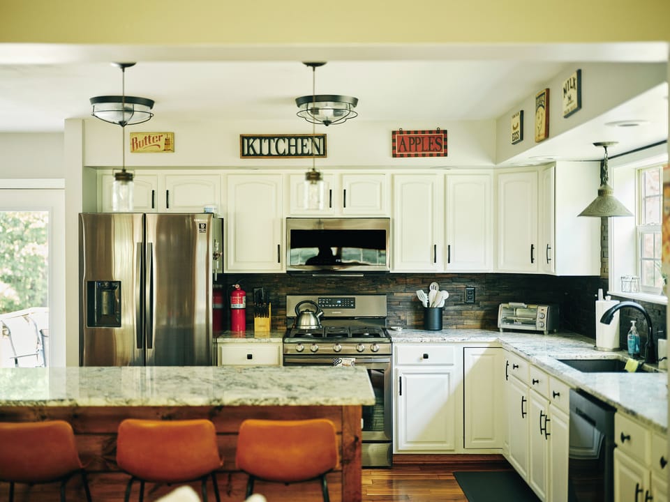 Step through French doors to a deck with BBQ and dining space.
