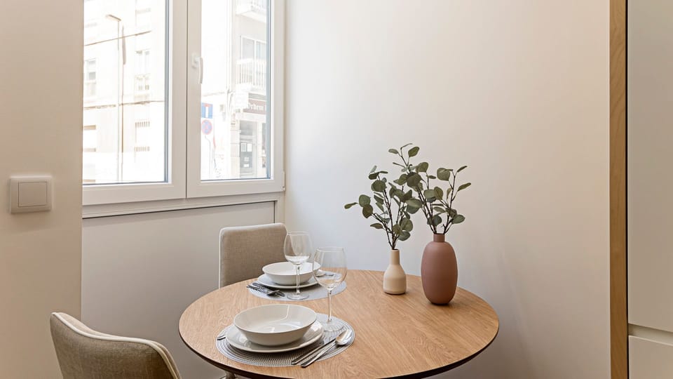 Savor intimate meals or your morning coffee at this charming dining nook, where the bright window view creates a pleasant ambiance for every bite.