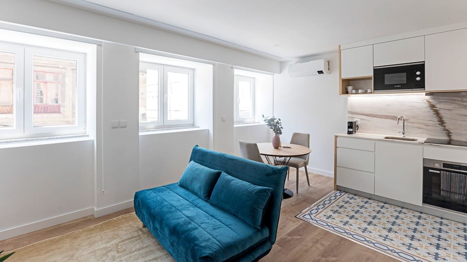 Bright living room with AC for cool summer days and cozy winter nights — the perfect space to relax.

#relax #bright #livingroom #lovelystay