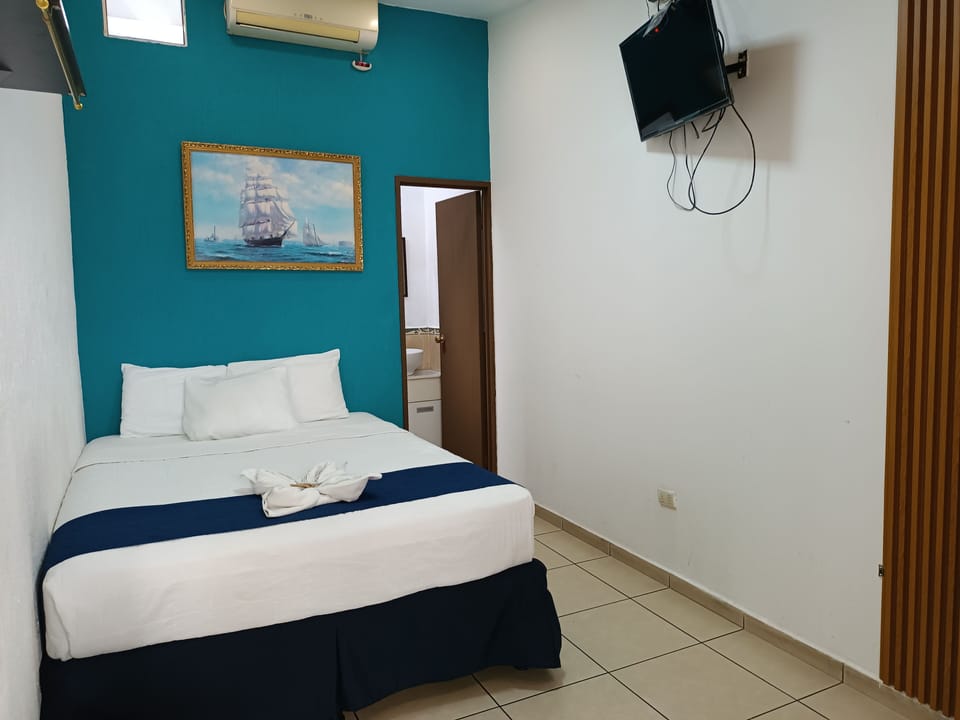 Economy Room | Blackout drapes, iron/ironing board (on request), WiFi (free)