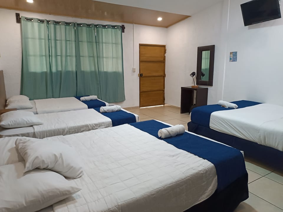Family Quadruple Room | Blackout drapes, iron/ironing board (on request), WiFi (free)