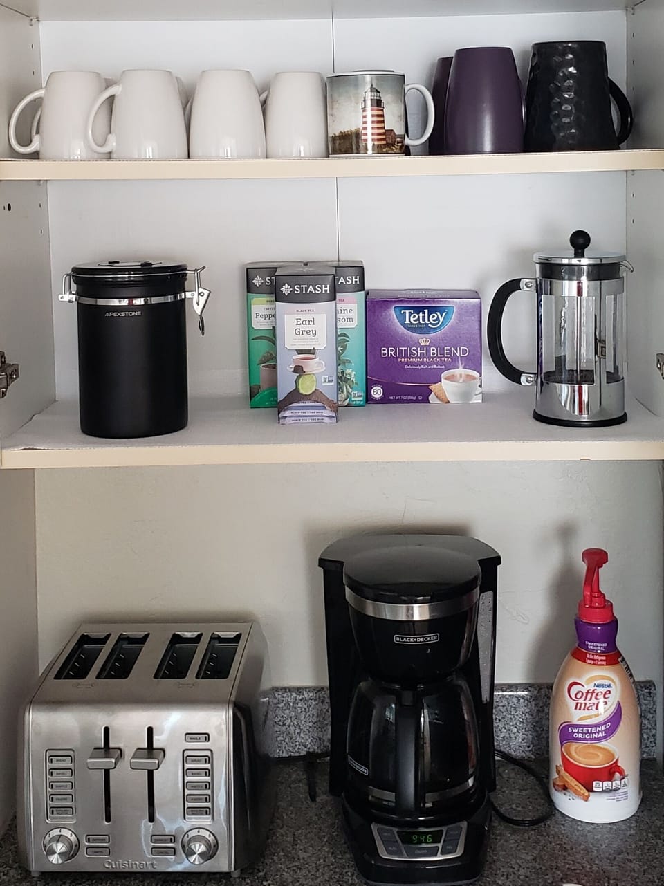 Drip coffee, tea, creamer, sugar are provided.