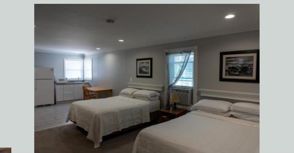 Family Room, 2 Queen Beds | Iron/ironing board, free WiFi, bed sheets