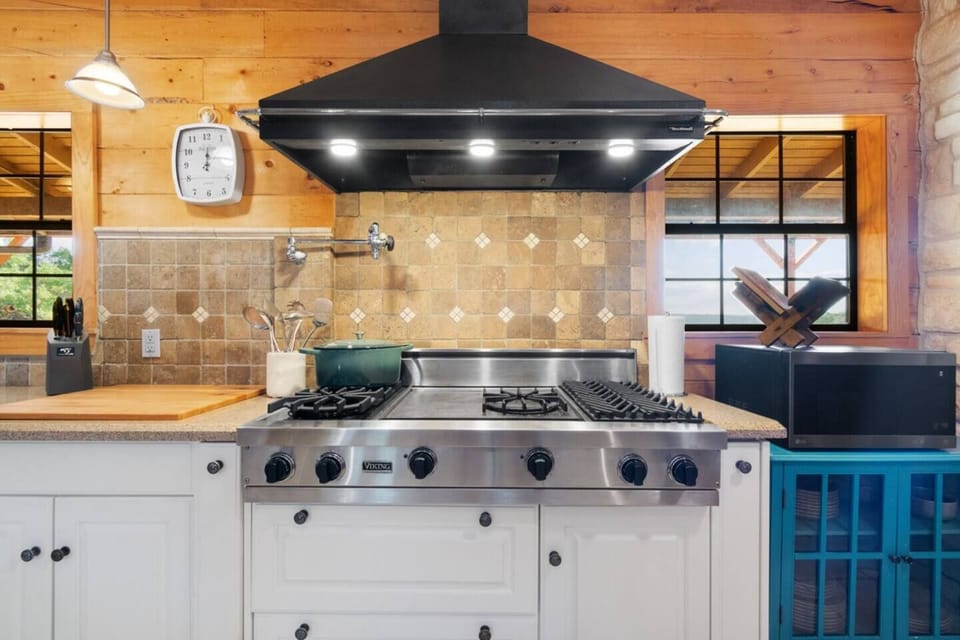 Modern meets functional in this well-equipped kitchen, designed to make cooking a pleasure with premium appliances and abundant storage.
