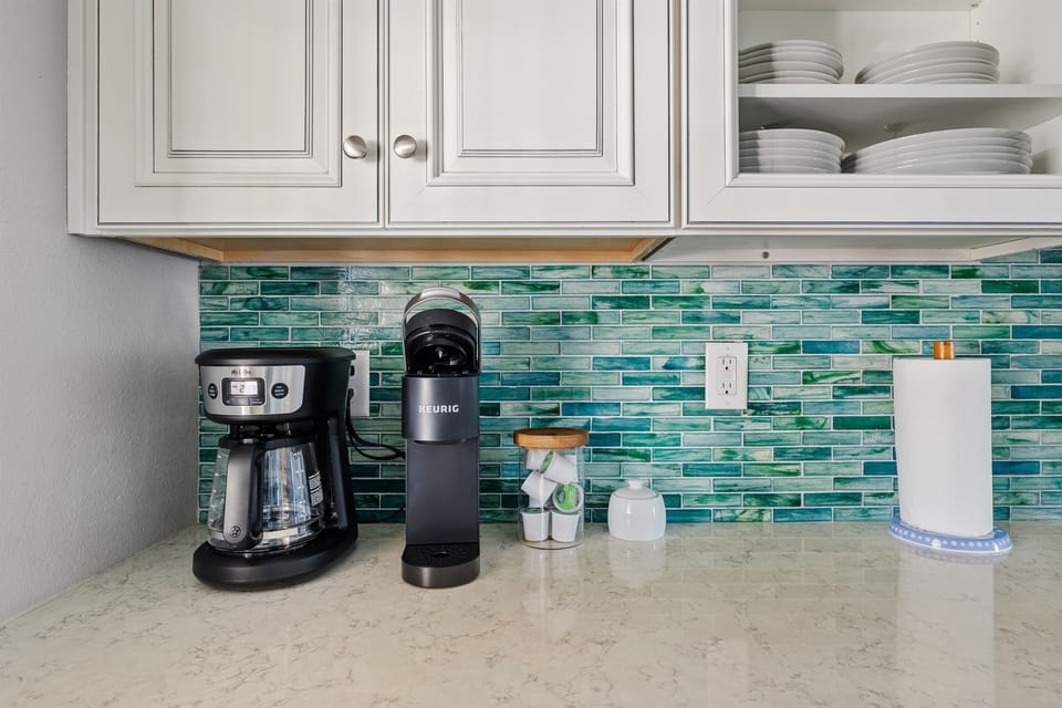 Traditional coffee pot and Keurig provided along with an assortment of coffee types.