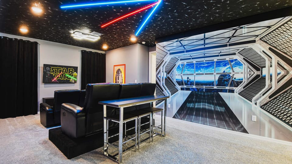 Epic sci-fi home theater with starry ceiling, themed walls, and cozy seating.