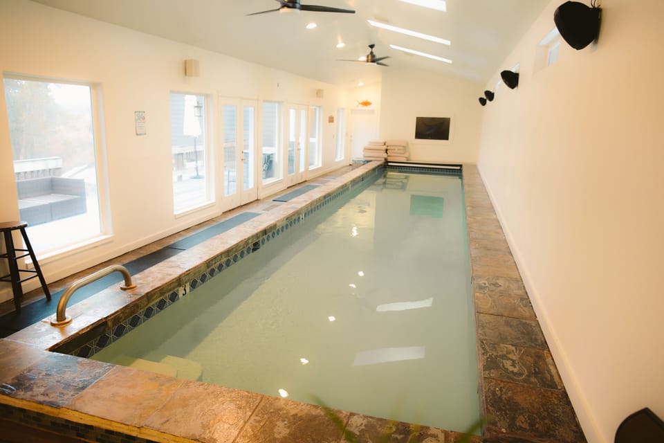Pool room with view to deck outside 