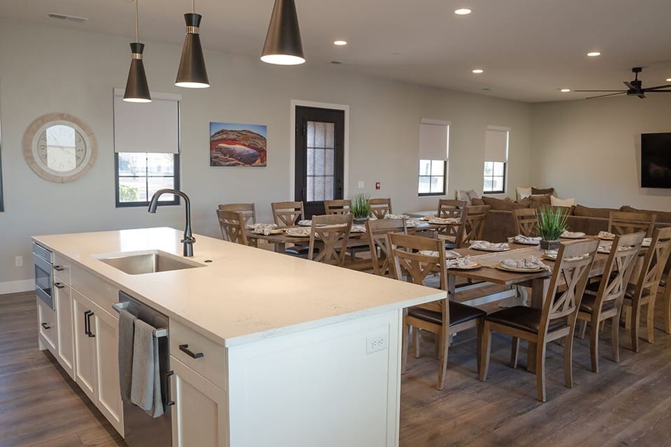 Kitchen looking towards dining room, tables, chairs , TV