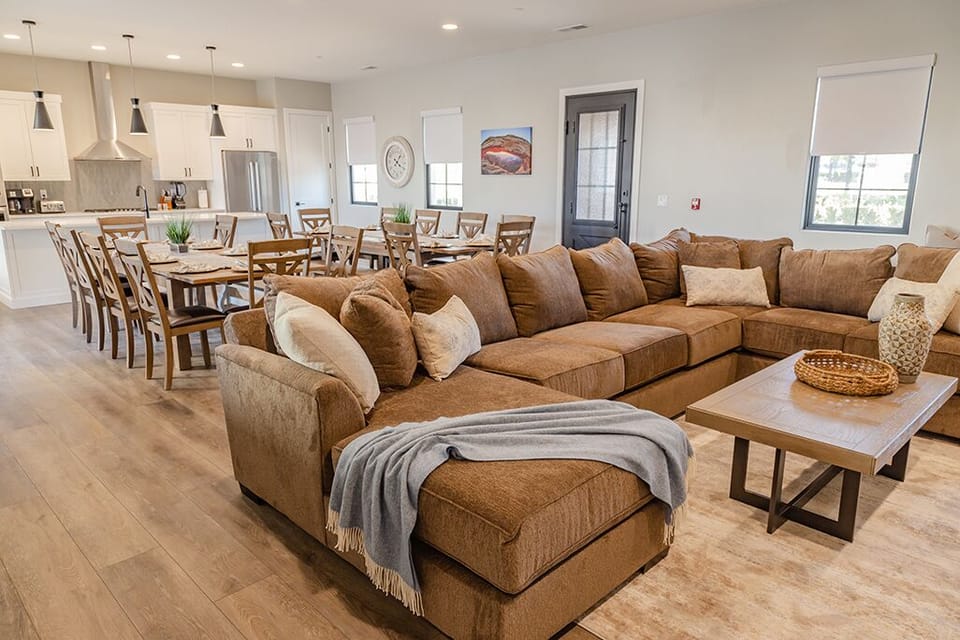 Standing in living room looking towards dining room/kitchen area