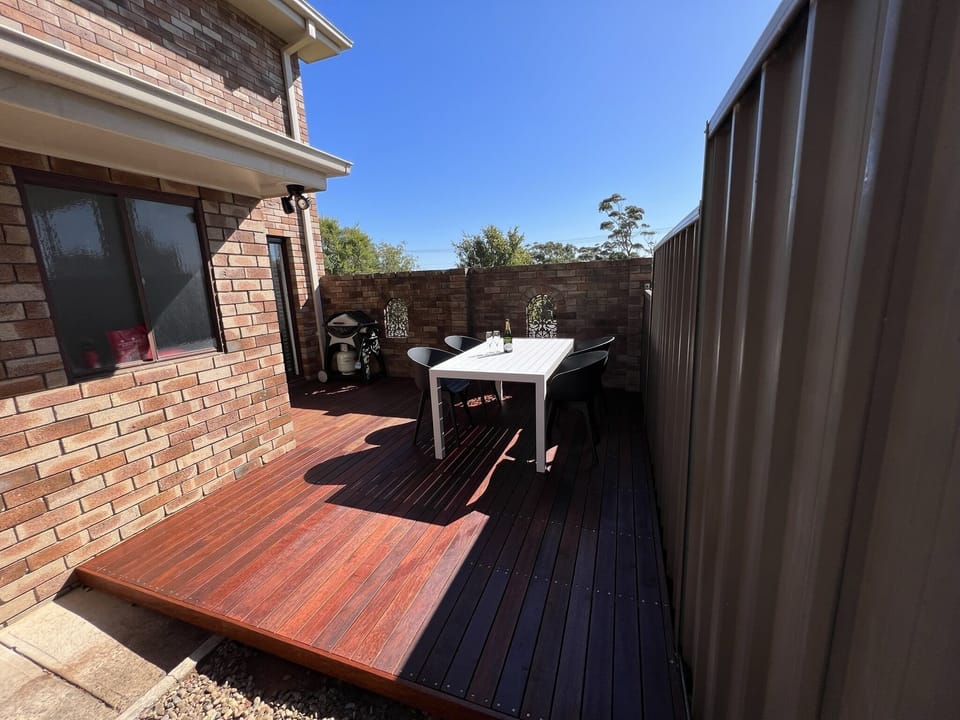 Private courtyard, wood deck, table and BBQ.
