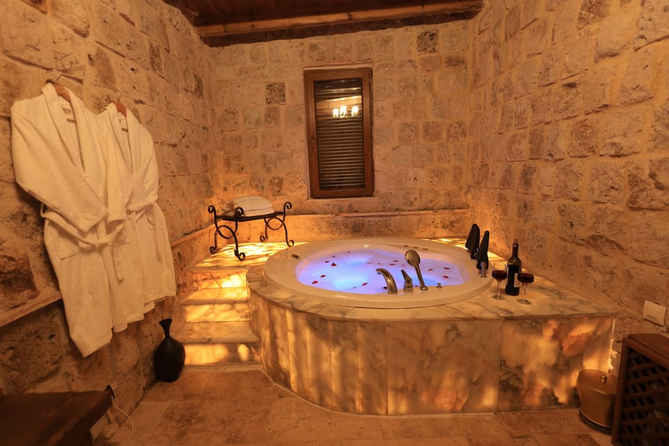 Family Suite | Bathroom | Designer toiletries, hair dryer, slippers, towels