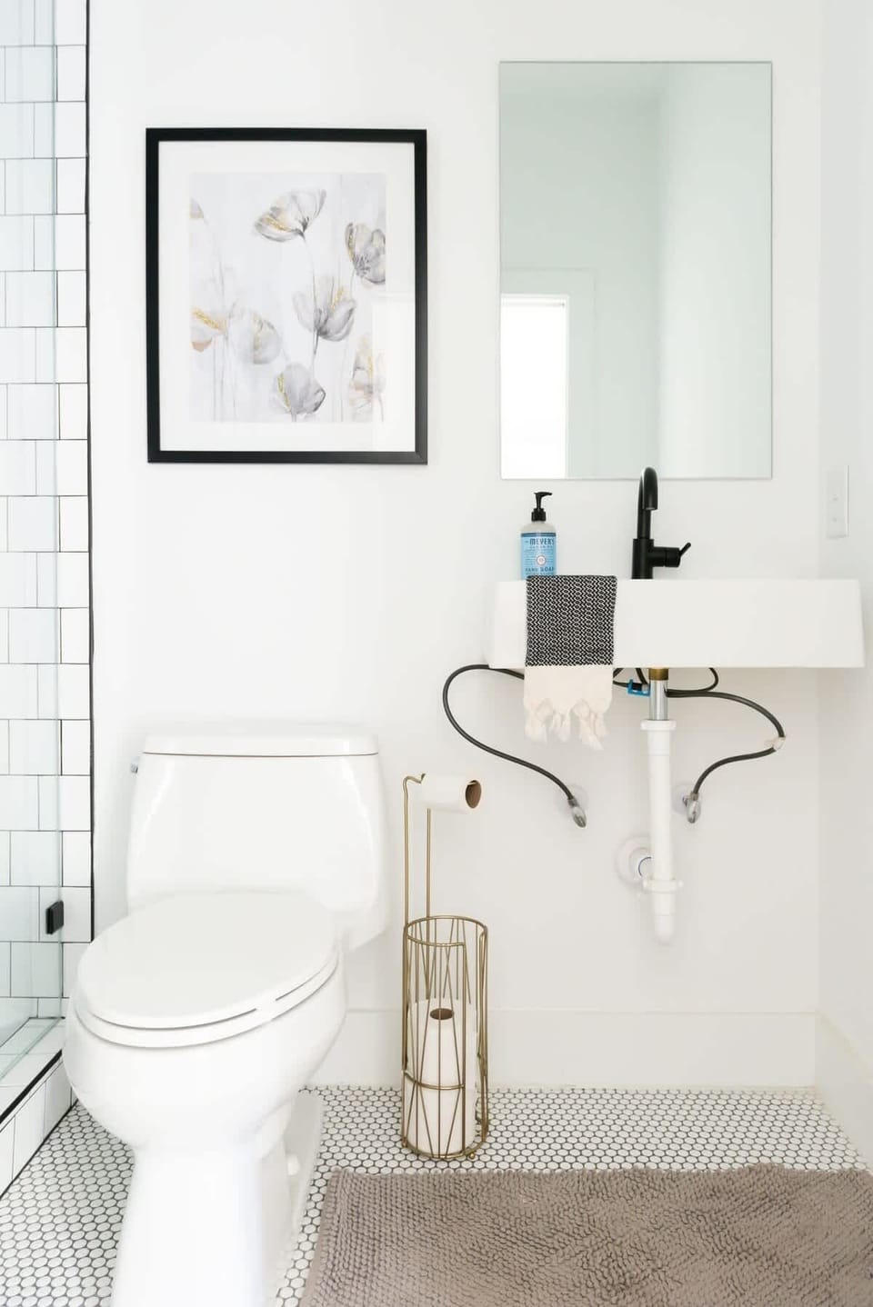 Refresh and rejuvenate in this stylishly updated bathroom, complete with modern fixtures that combine clean lines with classic comfort.