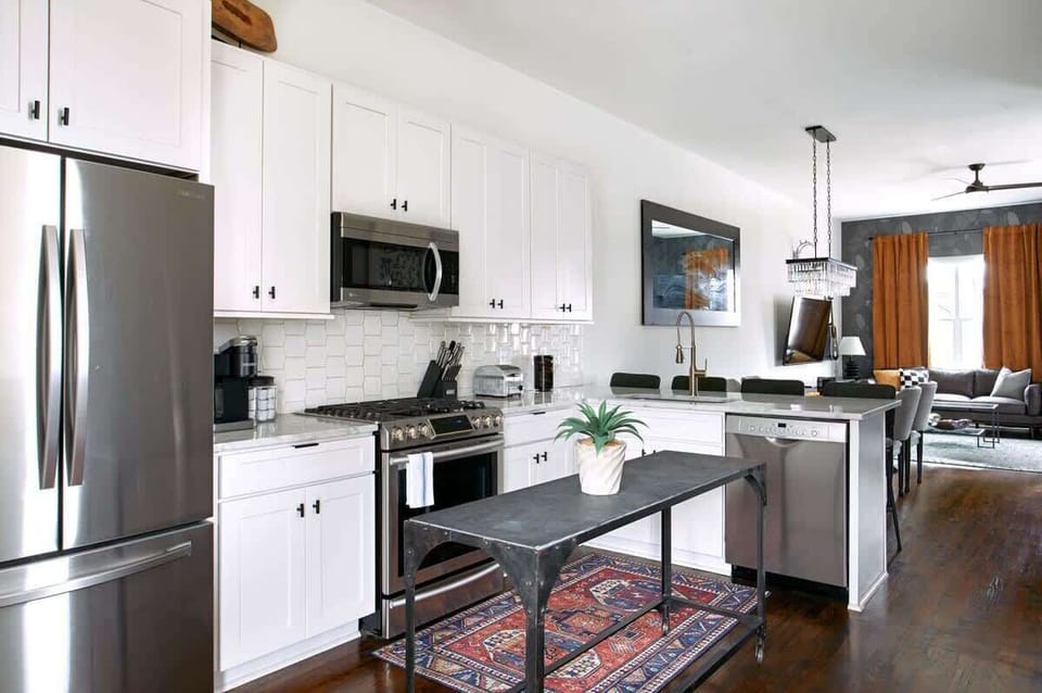 Transition seamlessly from the well-equipped kitchen to the stylish living area or onto the first of our two inviting decks.