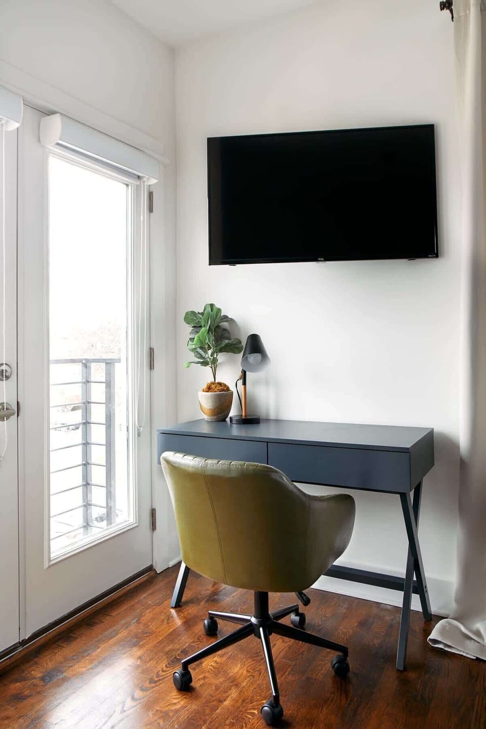 Settle in and get focused, this 3rd-floor bedroom corner is perfect for work and quiet moments.