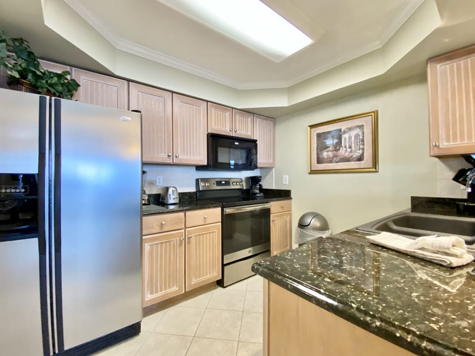 702 Remodeled Kitchen - Kitchen fully stocked! Everything you could need to cook in the condo