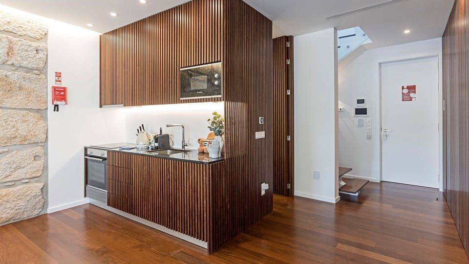 Lovely kitchenette, equipped with high-quality appliances and every supply you might need to prepare your homemade meals #modern #wonderful #lovelystay #airbnbporto