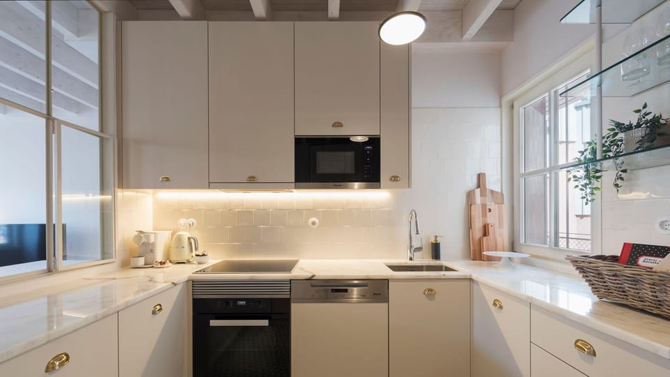 Lovely kitchenette, equipped with high-quality appliances and every supply you might need to prepare your homemade meals #modern #wonderful #lovelystay #airbnbporto