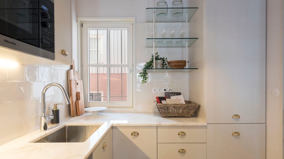 Lovely kitchenette, equipped with high-quality appliances and every supply you might need to prepare your homemade meals #modern #wonderful #lovelystay #airbnbporto