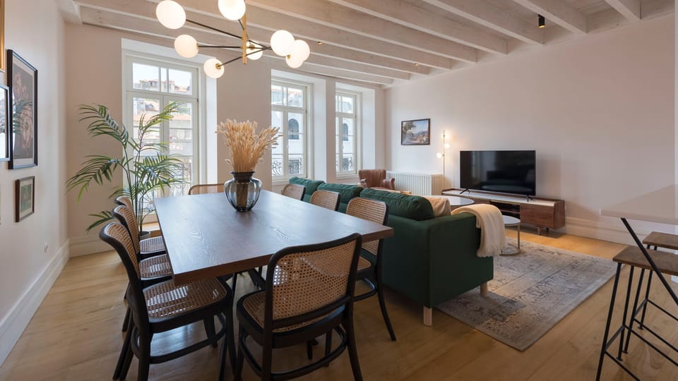 Spacious dining area, with a table that can accommodate up to eight people at a time, so you can enjoy your lovely homemade meals in the most comfort possible #modern #bright #lovelystay #airbnbporto