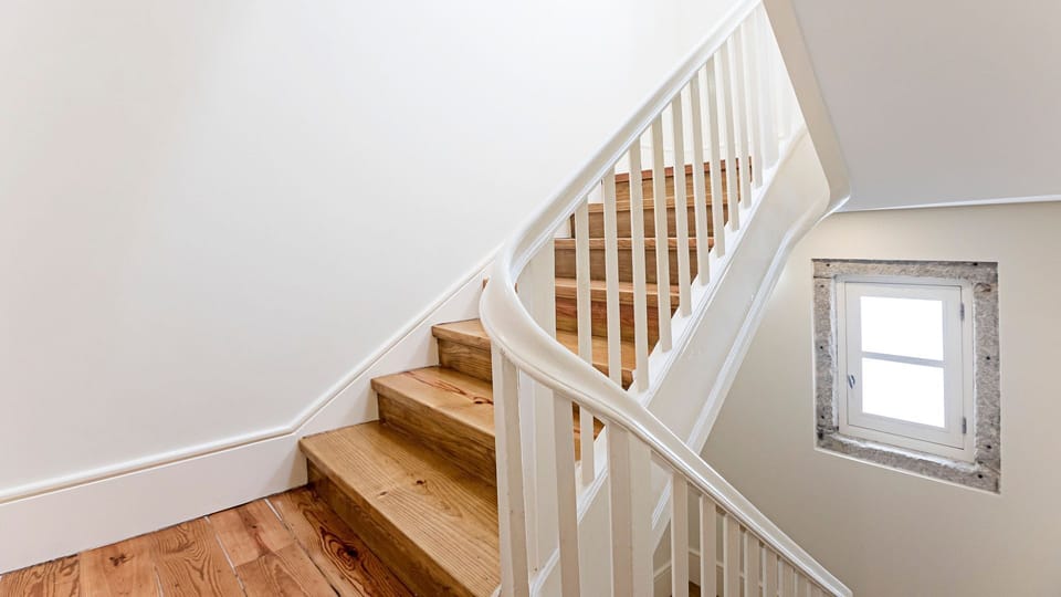 Ascend to your serene retreat via this charming wooden staircase, where classic white banisters and a quaint window invite natural light to guide your way. It’s an elegant entry that promises a peaceful and comfortable stay above.
#ElegantStairs #Historic