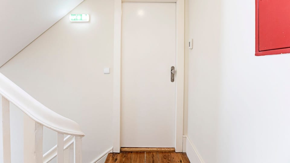 Enjoy a seamless and secure arrival through your private entrance, leading you up a clean and bright stairwell that offers a welcoming transition to your comfortable urban retreat.