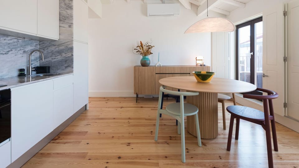 Dining area with unique furniture, next to a fully equipped kitchenette, with high-quality appliances and every supply you might need to prepare your homemade meals #superb #outstanding #lovelystay #airbnbporto
