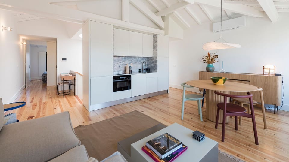 Dining area with unique furniture, next to a fully equipped kitchenette, with high-quality appliances and every supply you might need to prepare your homemade meals #superb #outstanding #lovelystay #airbnbporto