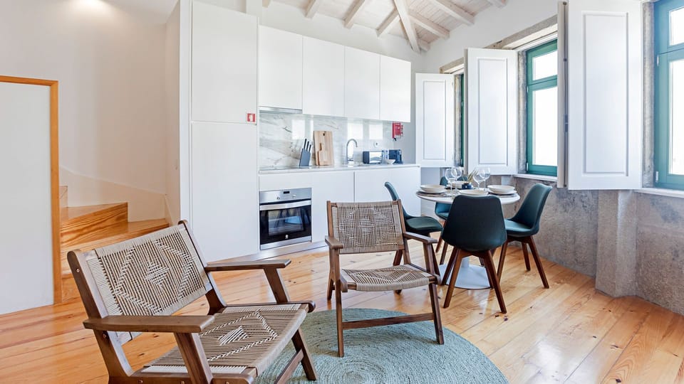 Lovely living area with lots of natural light, a dining table for four and two armchairs, to rest after a long day #relax #amazing