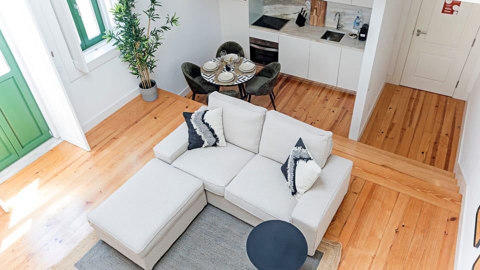Overview of the living area, as well as the dining area and kitchenette