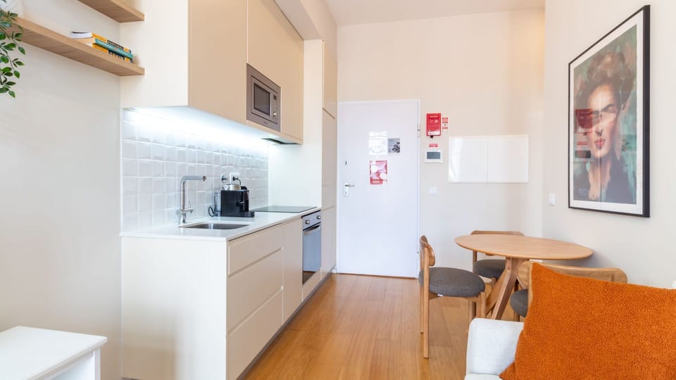 Prepare delicious meals in this well-appointed kitchen, then gather around the charming dining table for a cozy meal or plan your day over coffee. This vibrant space offers all you need for comfortable everyday living.